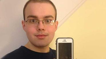 Patrick Vaillancourt holding up an iPhone