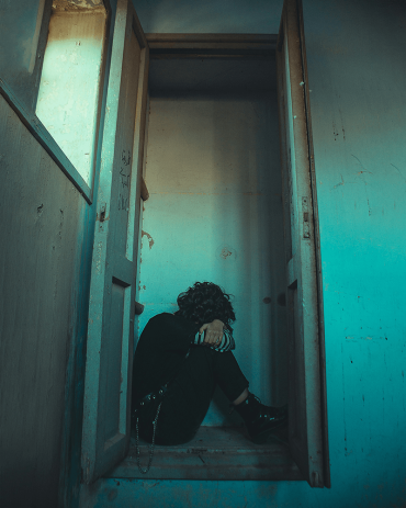 Person stressed out on a closet floor