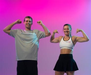 Tanner and Eva showing their muscles