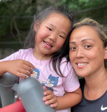 A person and a child posing for a picture
