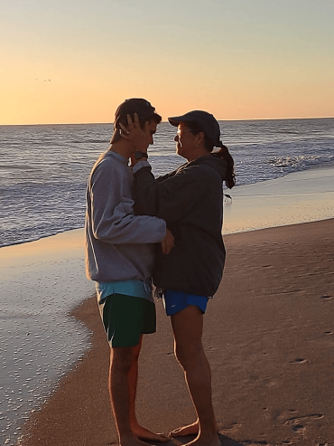 mother  and son on the beach at sunset