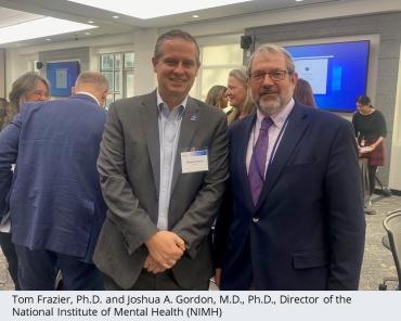 Tom Frazier, Ph.D. standing next to Joshua A. Gordon, M.D., Ph.D., Director of the National Institute of Mental Health (NIMH)
