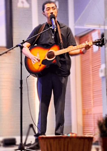 young man playing guitar