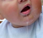 close up of a baby drooling