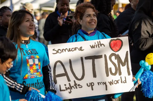 Autism Speaks Walkers holding a team sign